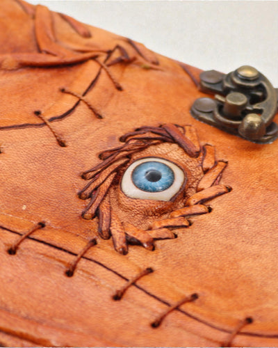 Svetlohnedý pieskový poznámkový blok – dekor so zlým okom – 160 strán s trhanými okrajmi – 17x12.5cm